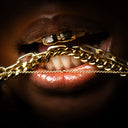 Gold chains by Wolfe Gemz in artistic shot, bold statement jewelry from Queens NYC