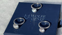 Three diamond rings on a Wolfe Gemz branded box