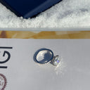 Diamond ring on a jewelry box with a blue background