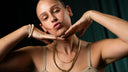 Layered gold chains and pearl bracelet from Wolfe Gemz, bold statement jewelry for urban professionals